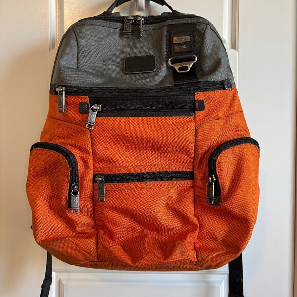 Tumi Handbags - Tumi backpack in orange and grey